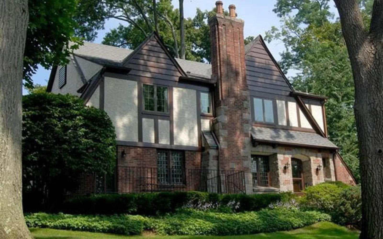 Suburban home in a residential neighborhood with mature landscaping and established character